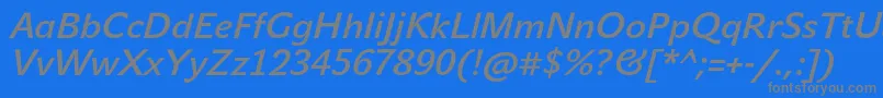 JohnsansMediumProItalic-fontti – harmaat kirjasimet sinisellä taustalla
