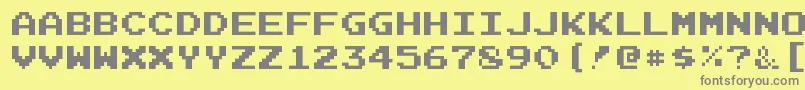 JoystixmonospaceRegular-fontti – harmaat kirjasimet keltaisella taustalla