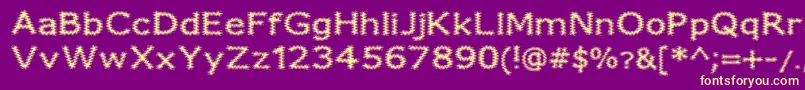 FuzzyXmas Font – Yellow Fonts on Purple Background