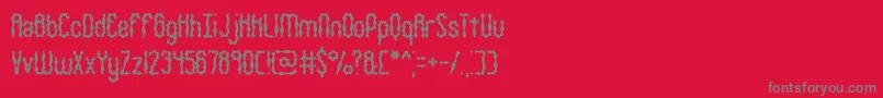 フォントWigsquig – 赤い背景に灰色の文字
