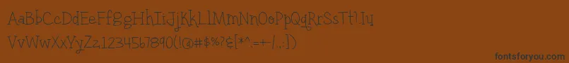 fuente BmdYellowUmbrellaThin – Fuentes Negras Sobre Fondo Marrón
