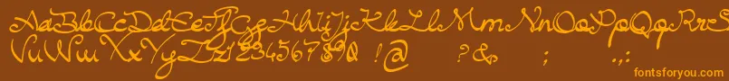 フォントBuffaloChicken – オレンジ色の文字が茶色の背景にあります。