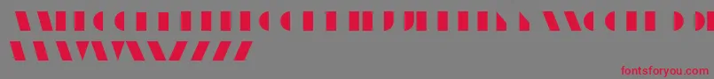 UnicumRegular Font – Red Fonts on Gray Background