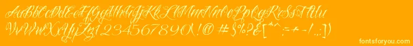 VtcNuetattooscript Font – Yellow Fonts on Orange Background