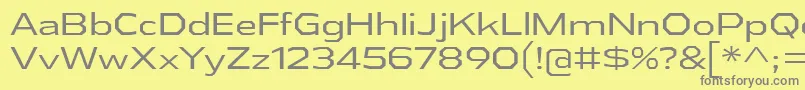 AthabascaExBk-fontti – harmaat kirjasimet keltaisella taustalla