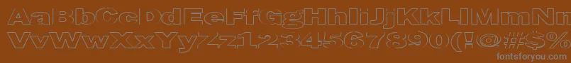 MaltfrankgothicheavyHe-fontti – harmaat kirjasimet ruskealla taustalla