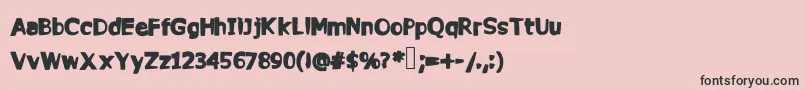 フォントCommy – ピンクの背景に黒い文字