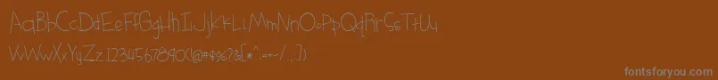 Шрифт BmdSomethingBlueRegular – серые шрифты на коричневом фоне