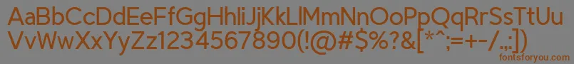 フォントTriompheLight – 茶色の文字が灰色の背景にあります。