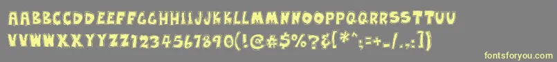 EarwaxWit Font – Yellow Fonts on Gray Background