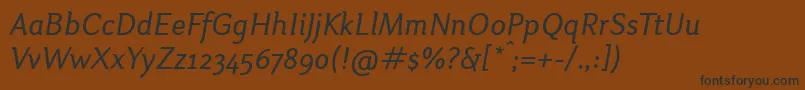 フォントOtariItalic – 黒い文字が茶色の背景にあります
