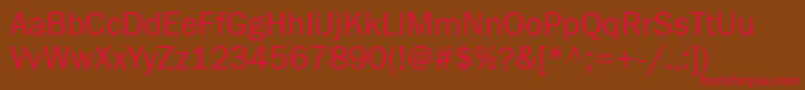 フォントFranklingothbookgtt – 赤い文字が茶色の背景にあります。