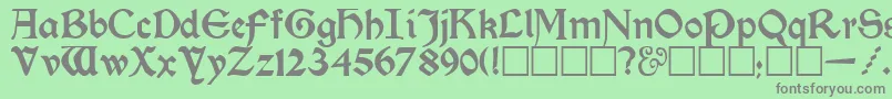 フォントKelmscottRegular – 緑の背景に灰色の文字