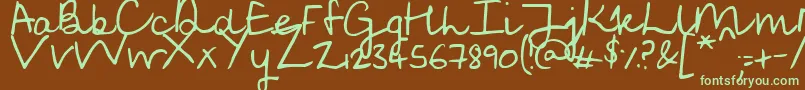 フォントSoggyKitten – 緑色の文字が茶色の背景にあります。