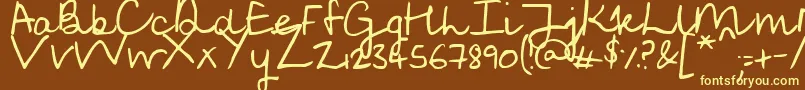 SoggyKitten-fontti – keltaiset fontit ruskealla taustalla
