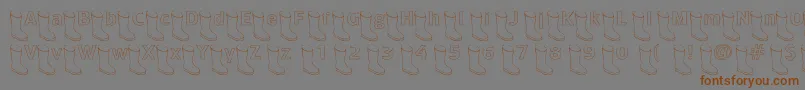 フォントOldboothollow – 茶色の文字が灰色の背景にあります。