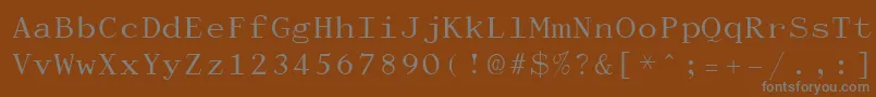 Dactylog-fontti – harmaat kirjasimet ruskealla taustalla