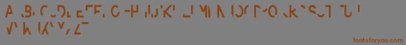 フォントAmputierte – 茶色の文字が灰色の背景にあります。