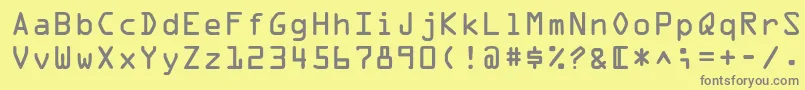 フォントOpticaladbNormal – 黄色の背景に灰色の文字