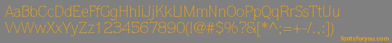 フォントItcQuorumLtLight – オレンジの文字は灰色の背景にあります。
