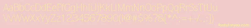 ItcQuorumLtLight-Schriftart – Gelbe Schriften auf rosa Hintergrund