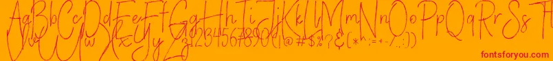 Czcionka VerticalBrushyFree – czerwone czcionki na pomarańczowym tle