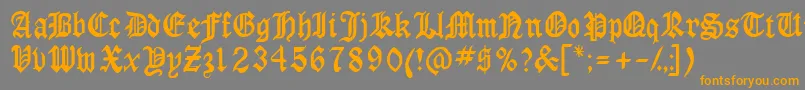 フォントAnglossk – オレンジの文字は灰色の背景にあります。