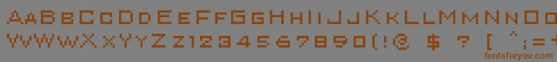 フォントSuperkar – 茶色の文字が灰色の背景にあります。