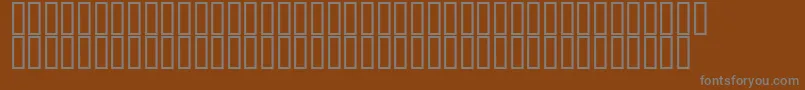 フォントSadvi25p – 茶色の背景に灰色の文字