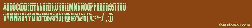 フォントGrendelsmotherlaser – 緑色の文字が茶色の背景にあります。