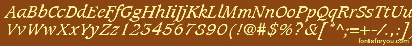 CaxtonLtBookItalic-fontti – keltaiset fontit ruskealla taustalla