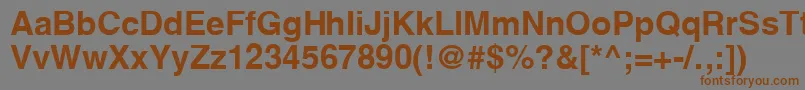 フォントYoxallB – 茶色の文字が灰色の背景にあります。