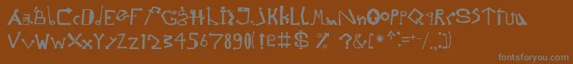 Strelochnikc Font – Gray Fonts on Brown Background
