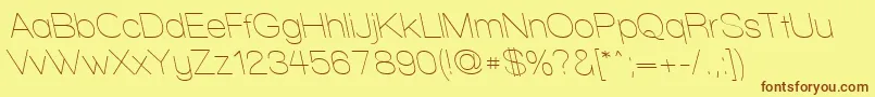 WalkwayRevoblique-Schriftart – Braune Schriften auf gelbem Hintergrund