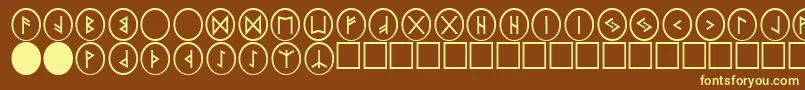 PrRunestones2-fontti – keltaiset fontit ruskealla taustalla