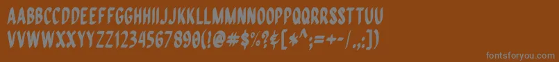 QuiapoFree-Schriftart – Graue Schriften auf braunem Hintergrund