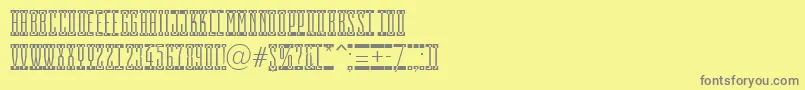 フォントAEmpirialcmsp – 黄色の背景に灰色の文字