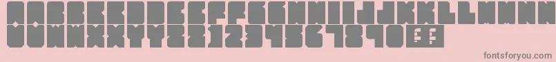 PartyHard-fontti – harmaat kirjasimet vaaleanpunaisella taustalla