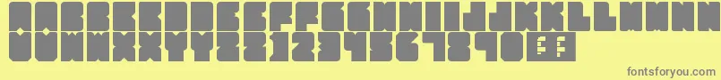 フォントPartyHard – 黄色の背景に灰色の文字