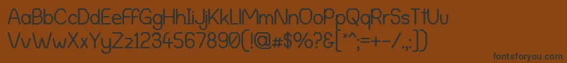 AlphaRomanieG98 Font – Black Fonts on Brown Background