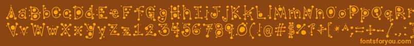 フォントCropCircles – オレンジ色の文字が茶色の背景にあります。