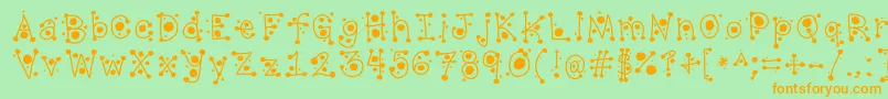 フォントCropCircles – オレンジの文字が緑の背景にあります。