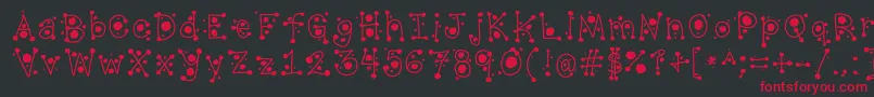 フォントCropCircles – 黒い背景に赤い文字