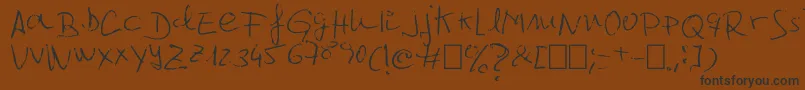 Jcgr61-fontti – mustat fontit ruskealla taustalla