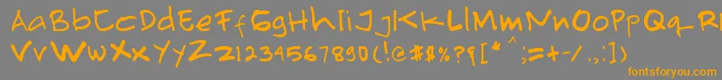 フォントPrimahandwrite – オレンジの文字は灰色の背景にあります。