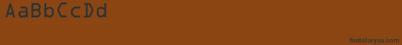 Czcionka Sadvocra – czarne czcionki na brązowym tle