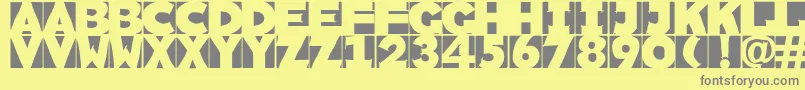 Sketchi-fontti – harmaat kirjasimet keltaisella taustalla