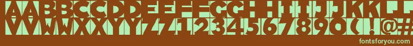 フォントSketchi – 緑色の文字が茶色の背景にあります。