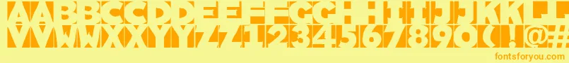 フォントSketchi – オレンジの文字が黄色の背景にあります。