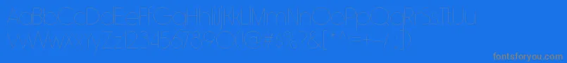 RimouskiulRegular-Schriftart – Graue Schriften auf blauem Hintergrund